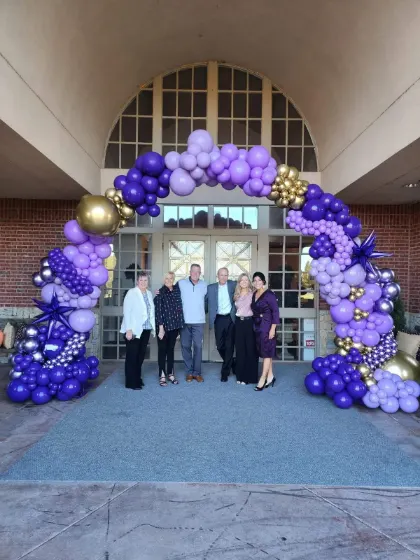 Balloon arch at the entrance to Sip & Swirl