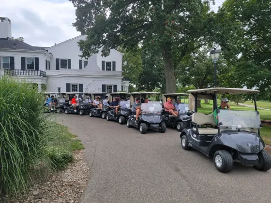Row of golf carts ready at the outing