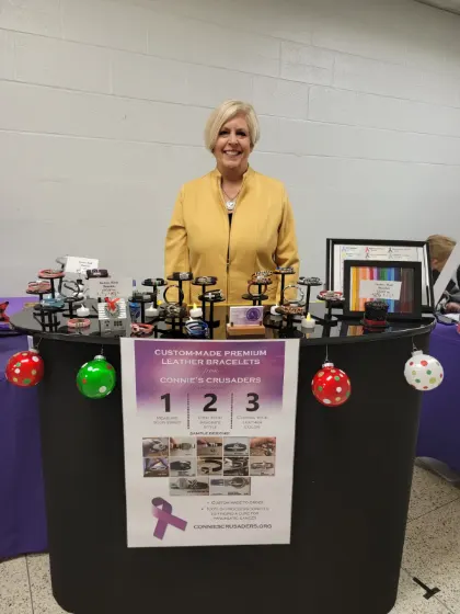 Susan at a craft show booth