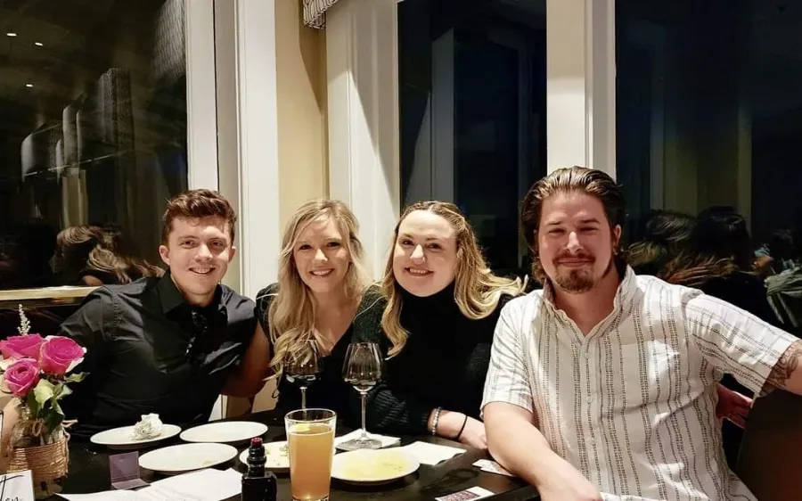 Four guests seated at a table during Sip & Swirl