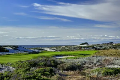 Coastal golf course with dunes and the ocean beyond